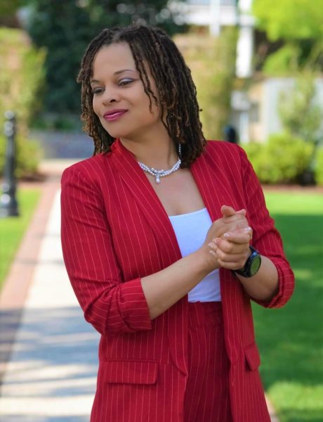 Josie - red suit - hands clasped - lookin-0001 (1)